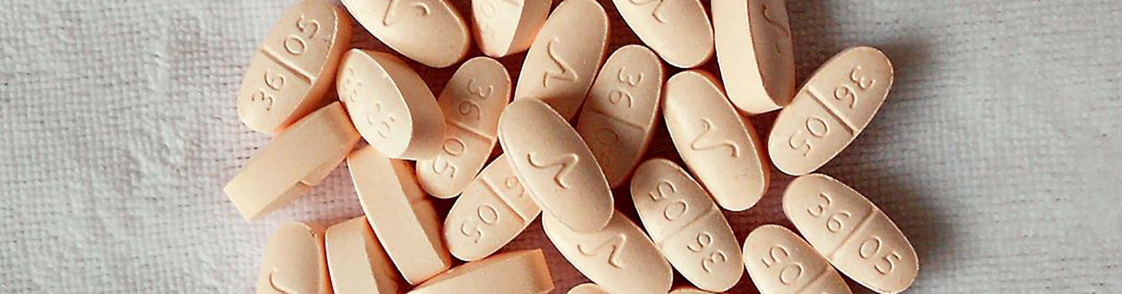 Hydrocodone pills for pain or cannabis treatment.