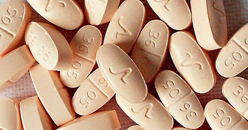 Hydrocodone pills for pain or cannabis treatment.